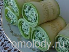 Zucchini rolls with nettles, nuts and cheese